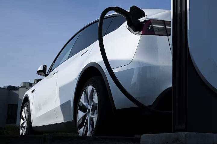 Tesla-car-is-being-charged-at-a-Tesla-electric-veh1715445615-2